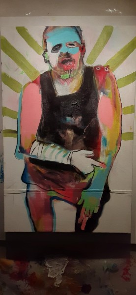 Painted standing figure with green rays